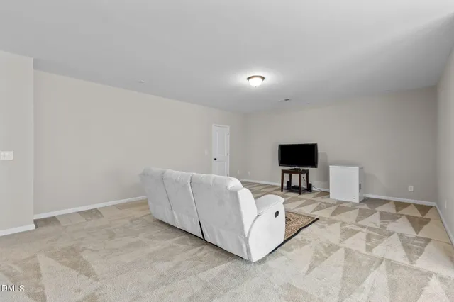 a room with gym equipment and a window