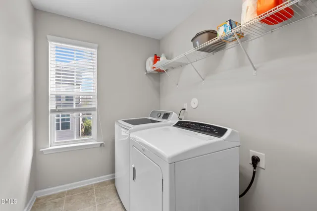 a bedroom with a bed and a ceiling fan in it