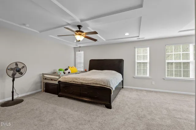 a bathroom with a bathtub sink and mirror