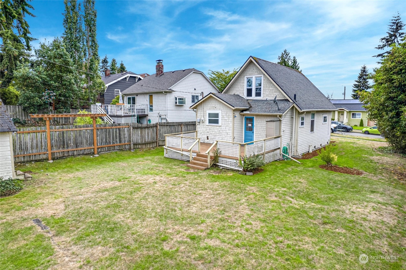 6344 37th Avenue Southwest Seattle, WA 98126 - Photo 16 of 20 a view of a house with a yard and sitting area