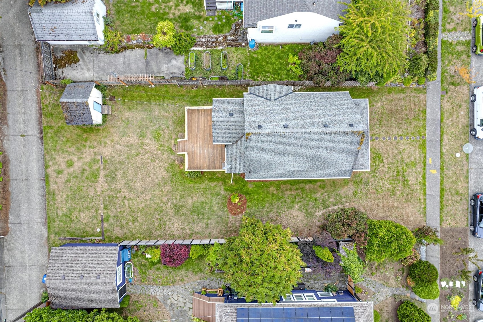 6344 37th Avenue Southwest Seattle, WA 98126 - Photo 17 of 20 an aerial view of a house with a yard and garden