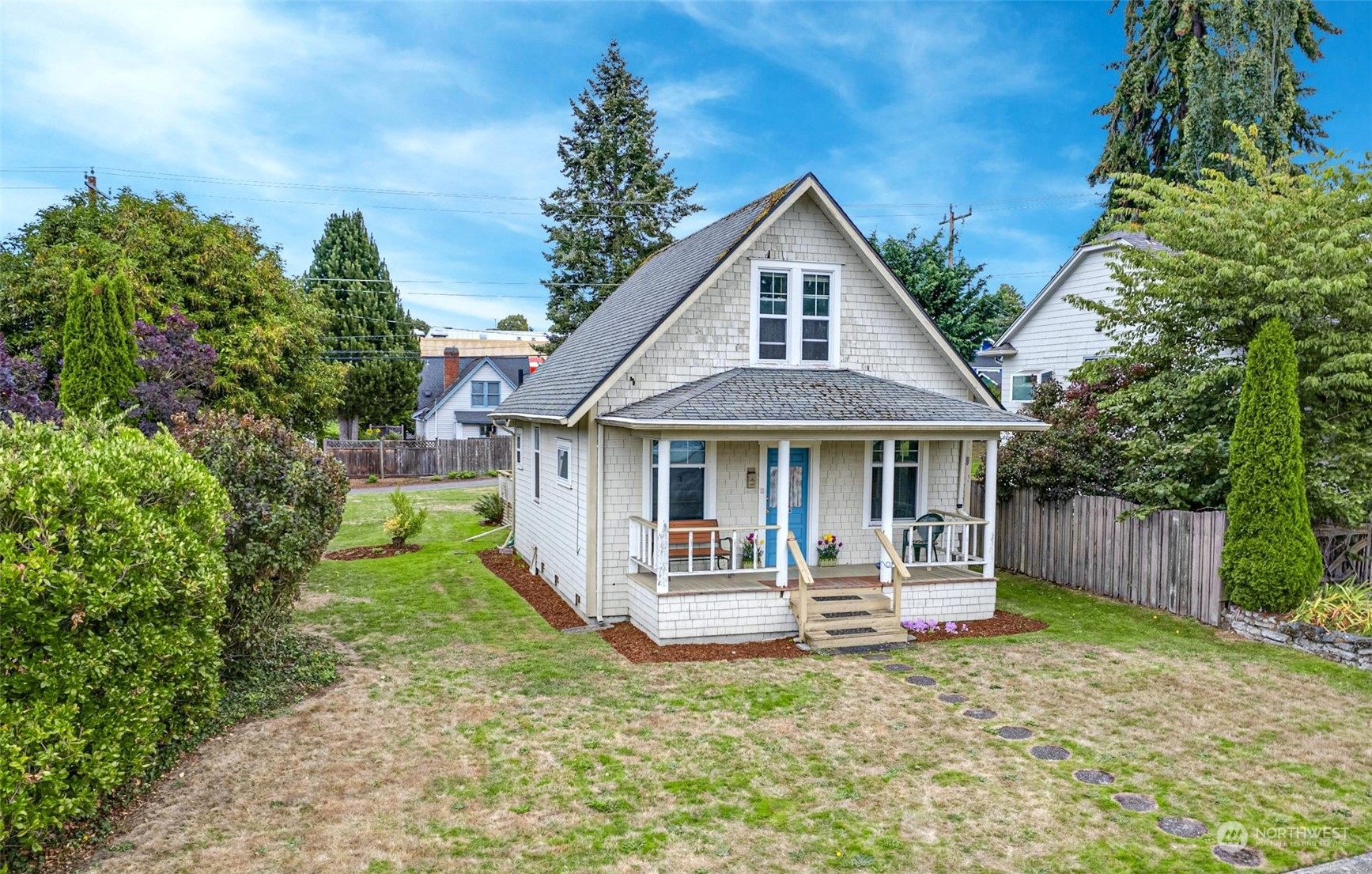 6344 37th Avenue Southwest Seattle, WA 98126 - Photo 18 of 20 a front view of a house with a yard