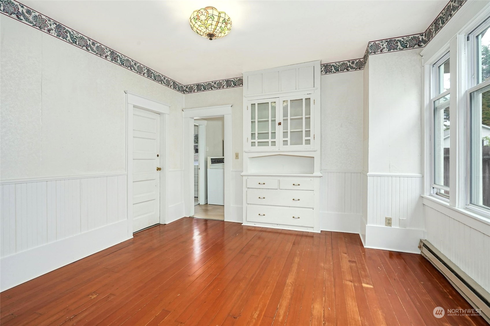 6344 37th Avenue Southwest Seattle, WA 98126 - Photo 6 of 20 wooden floor in an empty room with a window