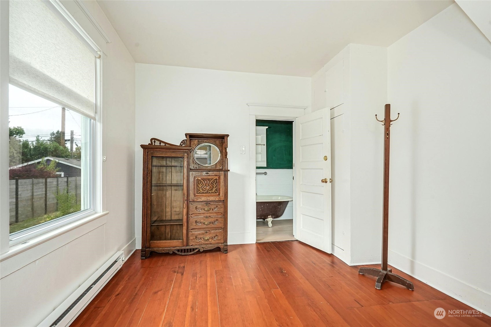 6344 37th Avenue Southwest Seattle, WA 98126 - Photo 9 of 20 a view of empty room with wooden floor and fan