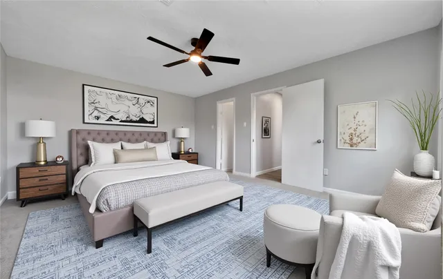 a view of a livingroom with a ceiling fan and window