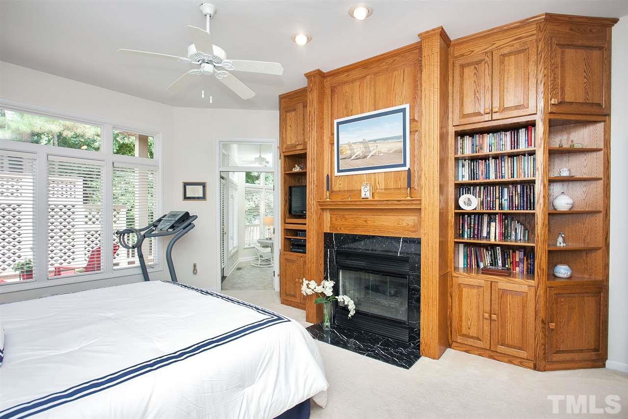 201 Release Circle Raleigh, NC 27615 - Photo 12 of 25 Enjoy more hand-craft oak built-ins and a cozy gas log fireplace in the spacious master suite with private deck.