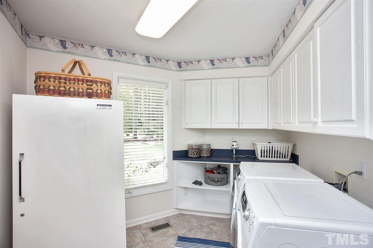 201 Release Circle Raleigh, NC 27615 - Photo 20 of 25 This laundry is equipped with what everyone needs - plenty of room for the most modern appliances plus storage, storage and more storage.