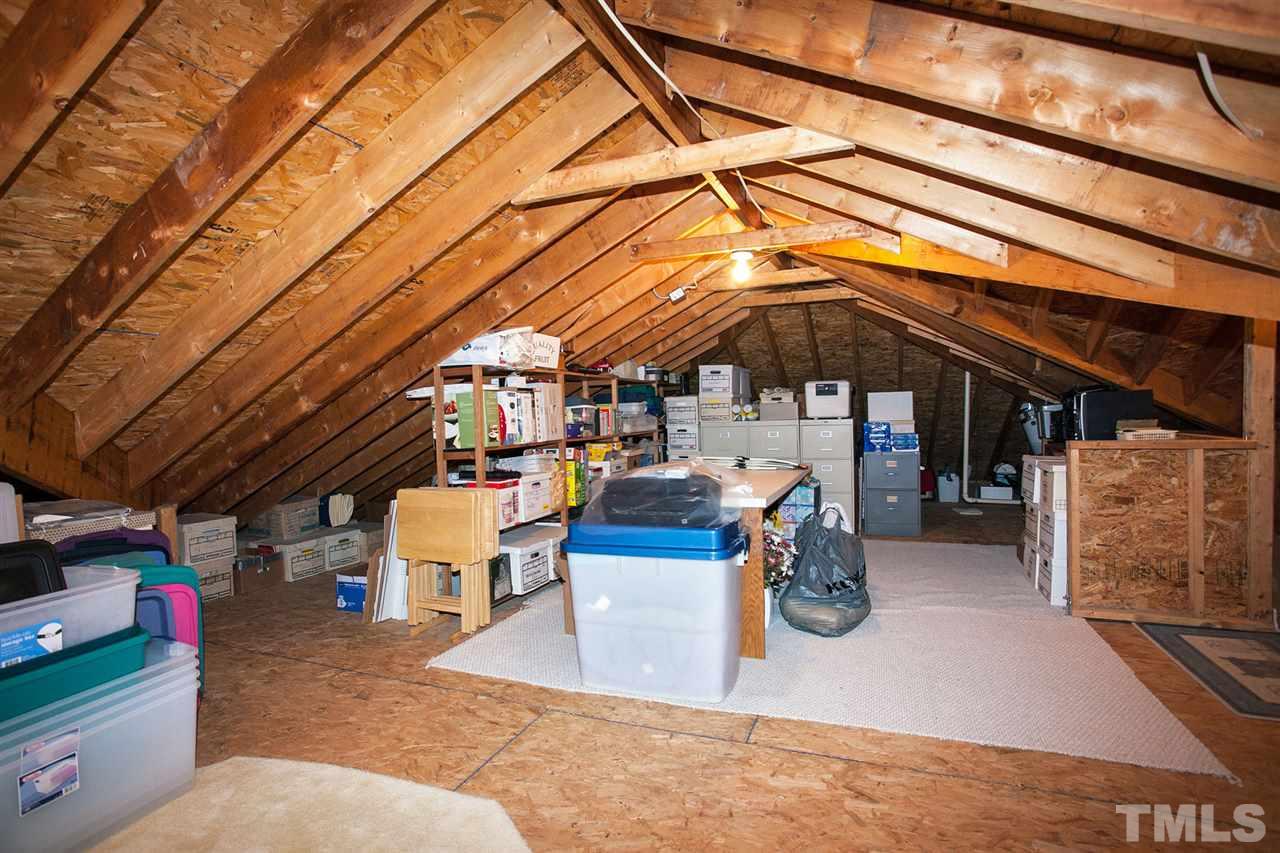 201 Release Circle Raleigh, NC 27615 - Photo 21 of 25 And speaking of storage...while the ceilings up here can be a little low in places, this walk-up attic has "acres" of storage. Be sure to take a look when you visit.