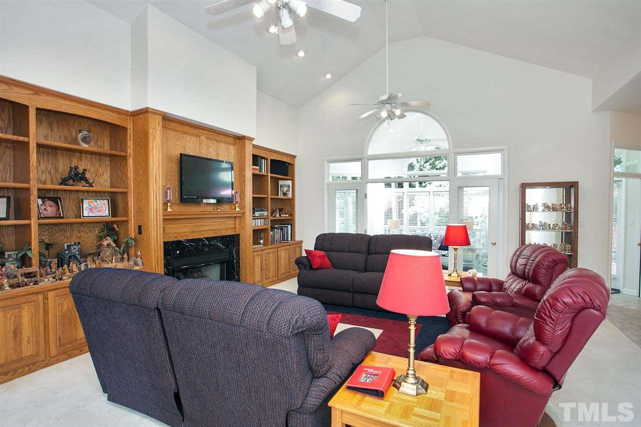 201 Release Circle Raleigh, NC 27615 - Photo 4 of 25 Gather your friends and family in this large family space featuring hand-crafted oak built-ins, gas log fireplace, and lots of natural light.