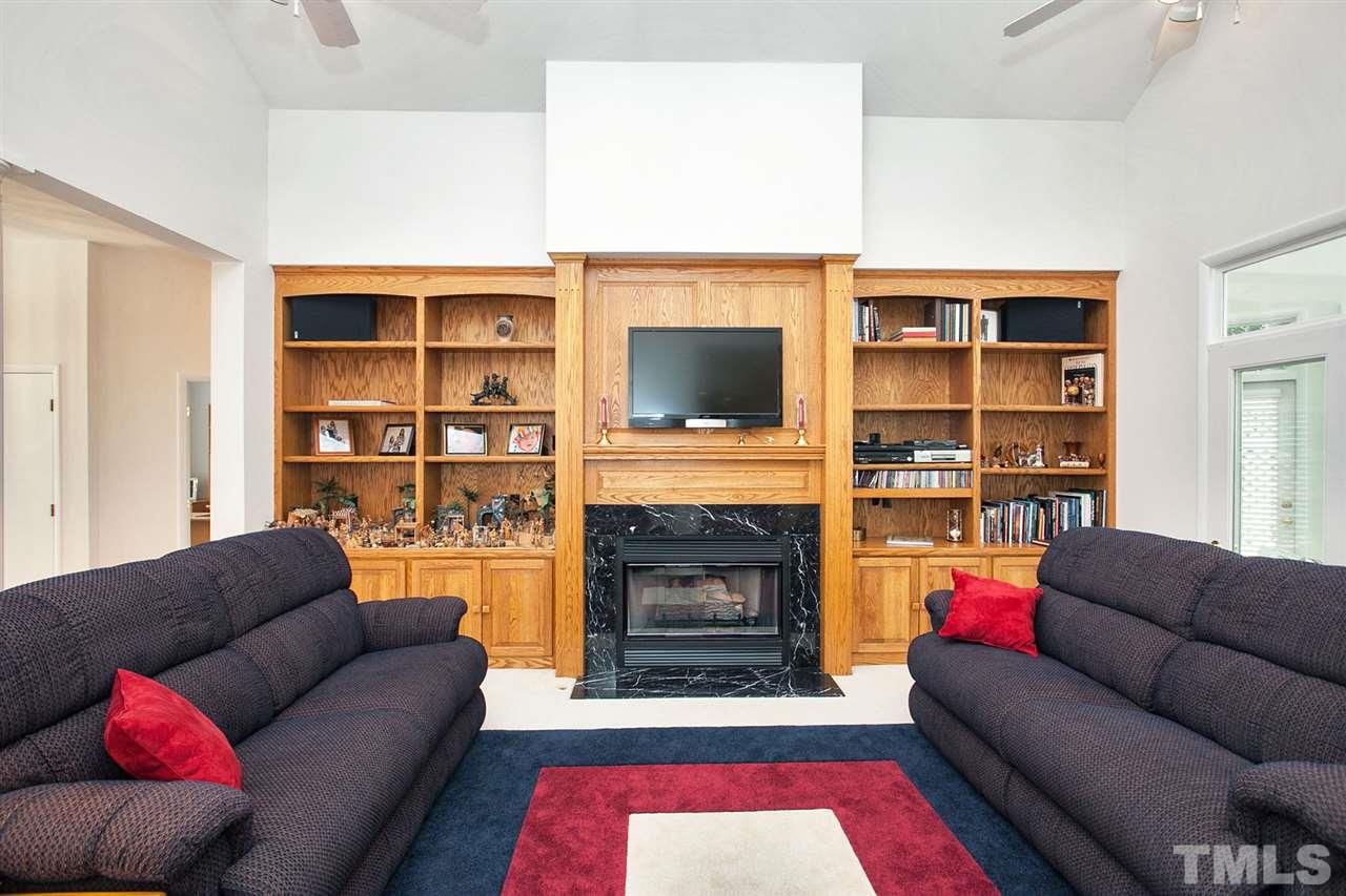201 Release Circle Raleigh, NC 27615 - Photo 5 of 25 Gather your friends and family in this large family space featuring hand-crafted oak built-ins, gas log fireplace, and lots of natural light.