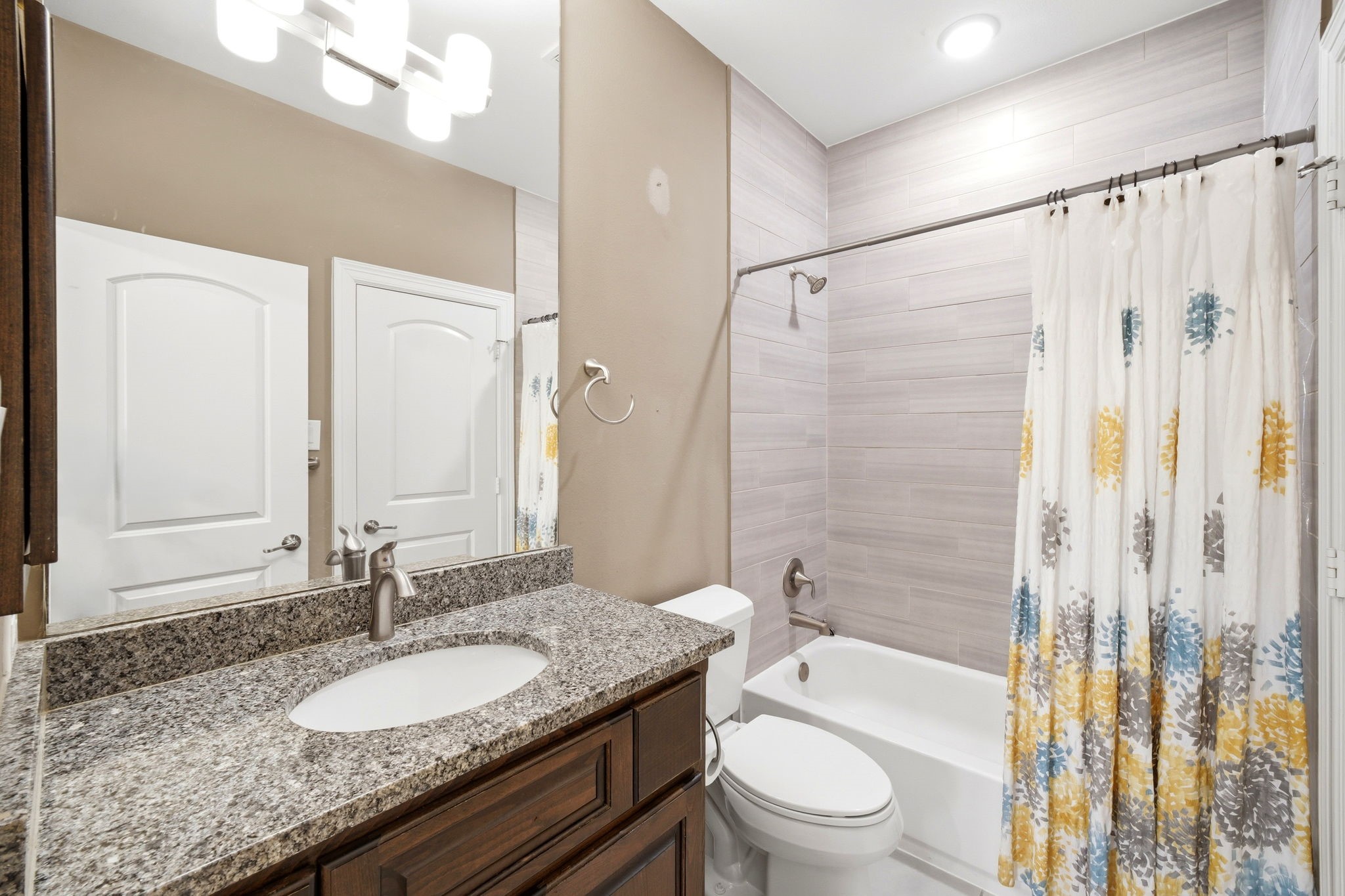 5815 Stratton Woods Drive Spring, TX 77389 - Photo 45 of 45 a bathroom with a granite countertop sink toilet mirror and shower