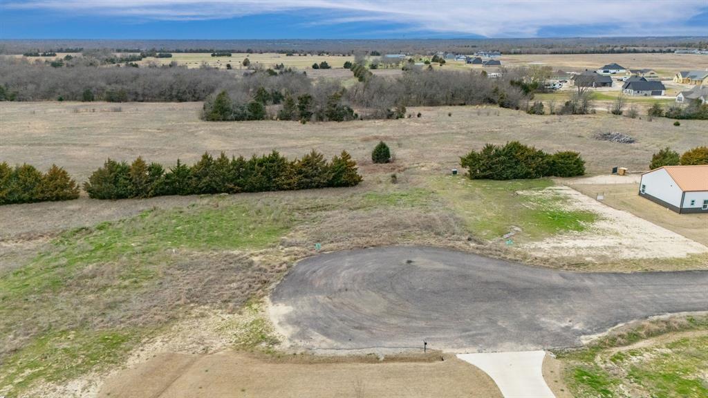 2810 Maple Road Celeste, TX 75423 - Photo 4 of 13 a view of a field with wooden fence