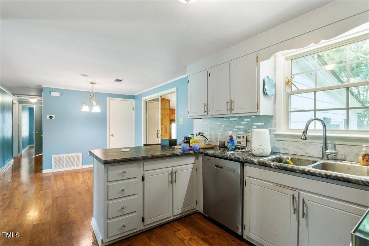 65 Pine View Road Henderson, NC 27537 - Photo 13 of 43 a kitchen with a sink stove and cabinets