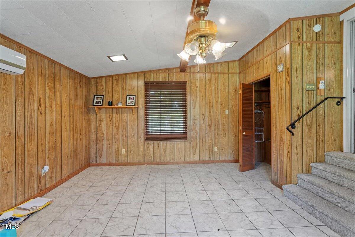65 Pine View Road Henderson, NC 27537 - Photo 18 of 43 a view of a hallway with chandelier and dining area