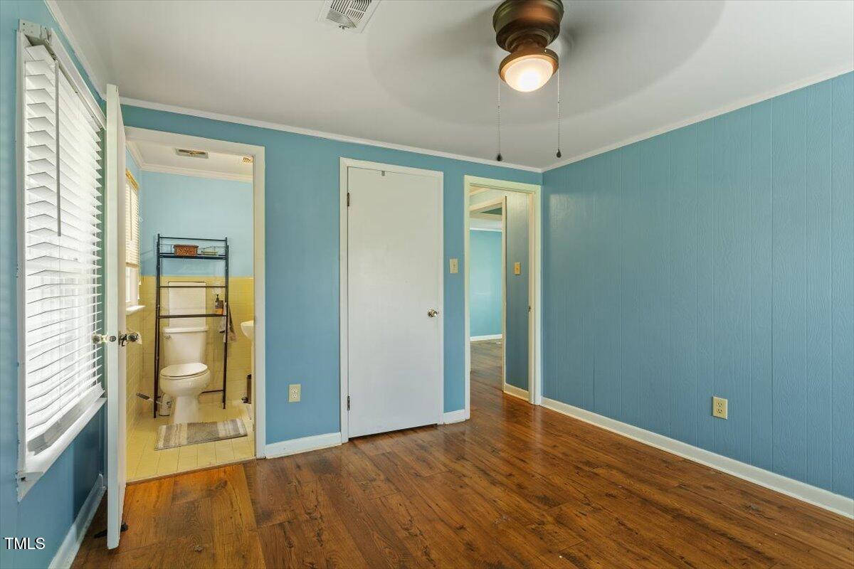 65 Pine View Road Henderson, NC 27537 - Photo 21 of 43 a view of an empty room with wooden floor and windows