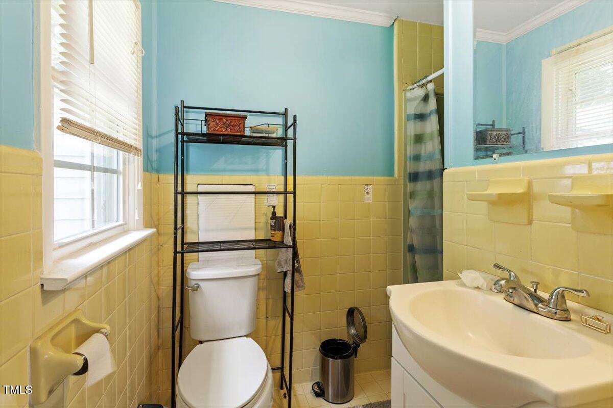 65 Pine View Road Henderson, NC 27537 - Photo 22 of 43 a bathroom with a sink and a mirror
