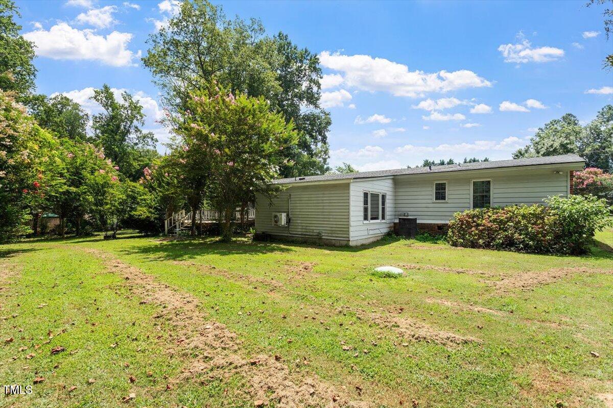65 Pine View Road Henderson, NC 27537 - Photo 31 of 43 a view of a backyard with a garden