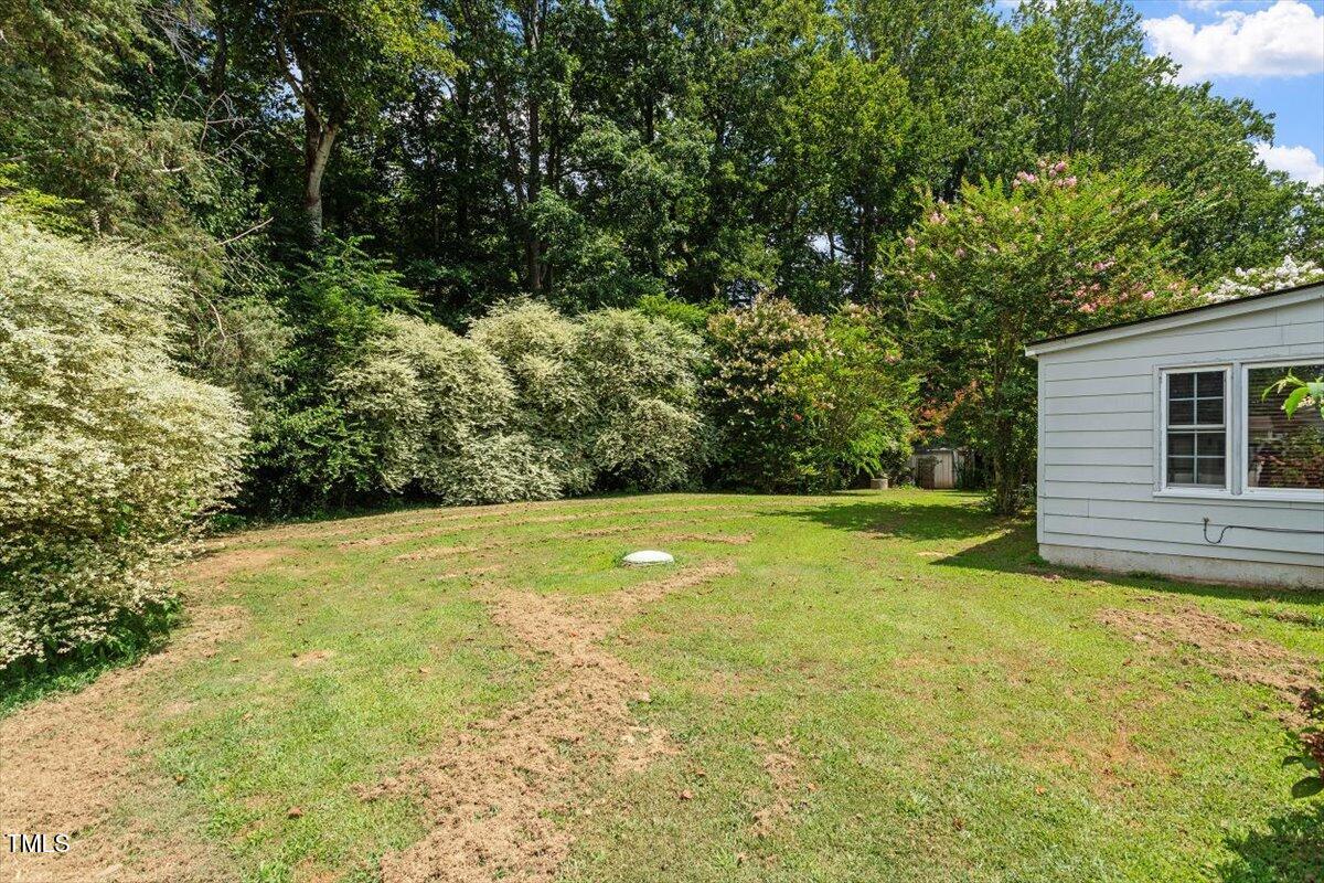 65 Pine View Road Henderson, NC 27537 - Photo 32 of 43 a view of a yard with a house