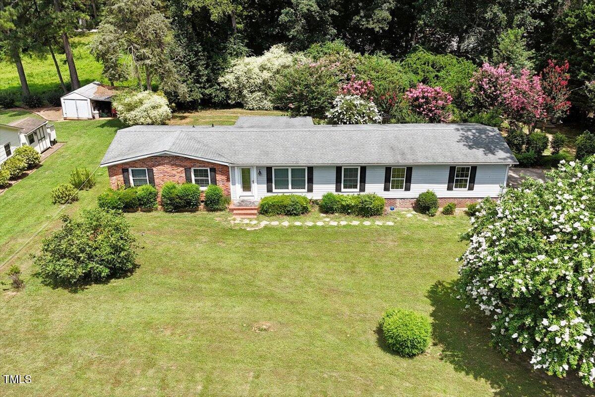 65 Pine View Road Henderson, NC 27537 - Photo 33 of 43 a front view of house with yard and green space