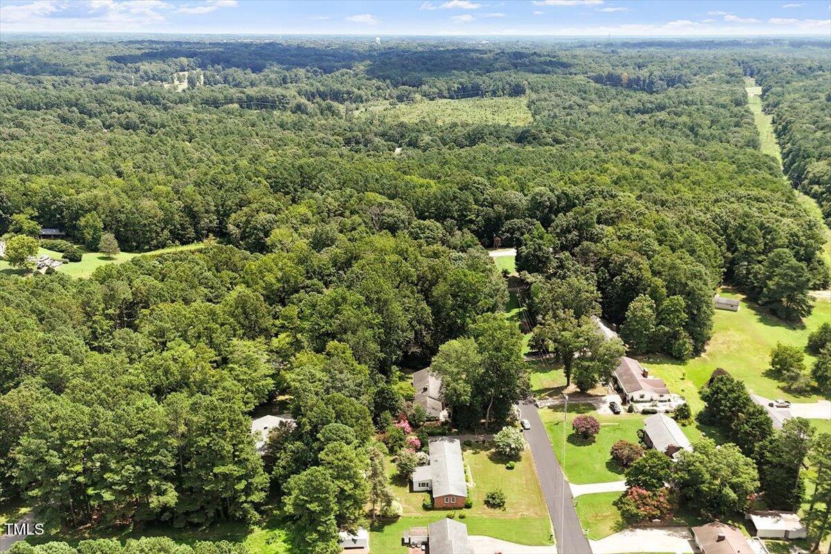 65 Pine View Road Henderson, NC 27537 - Photo 39 of 43 an aerial view of residential houses with outdoor space and trees