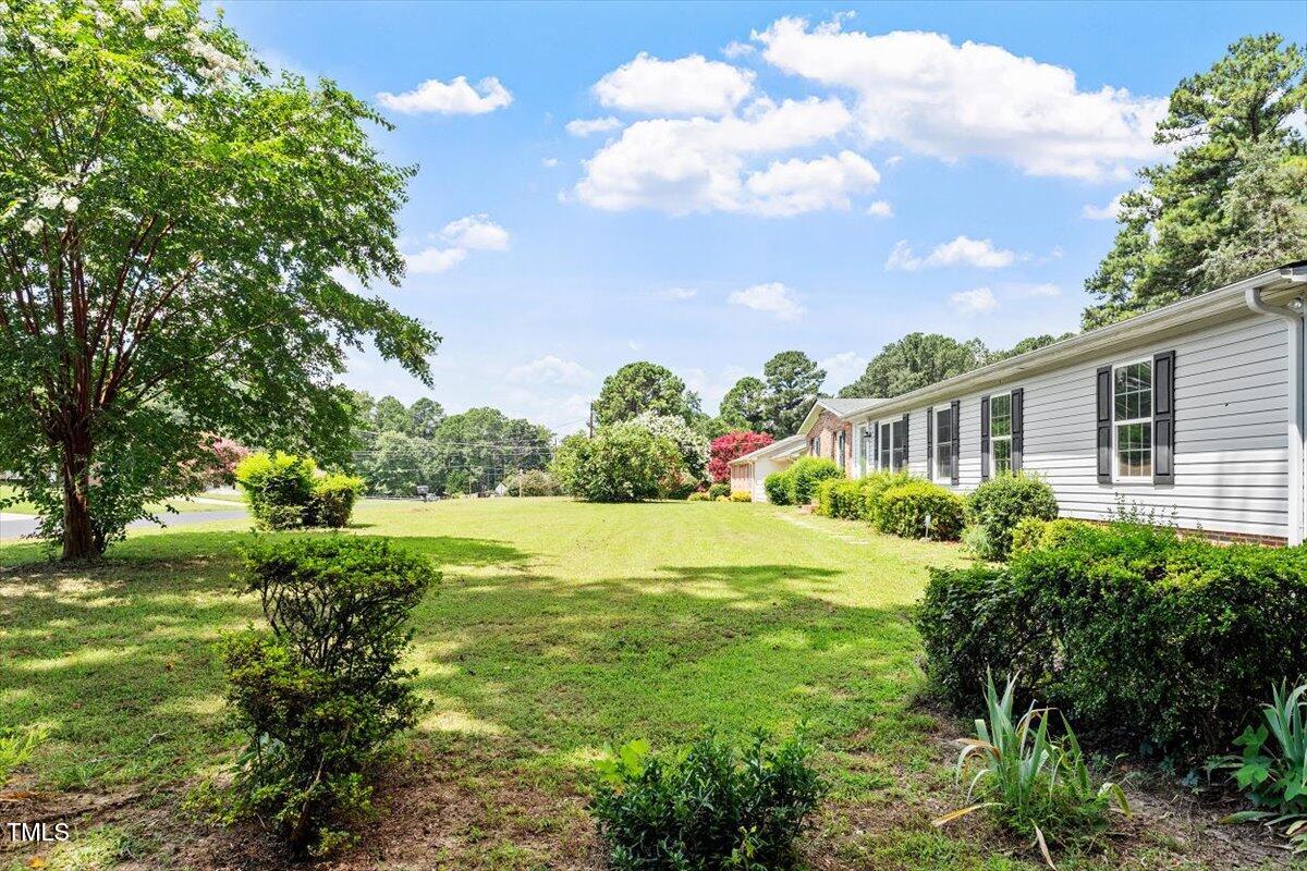 65 Pine View Road Henderson, NC 27537 - Photo 3 of 43 a view of a garden with a house