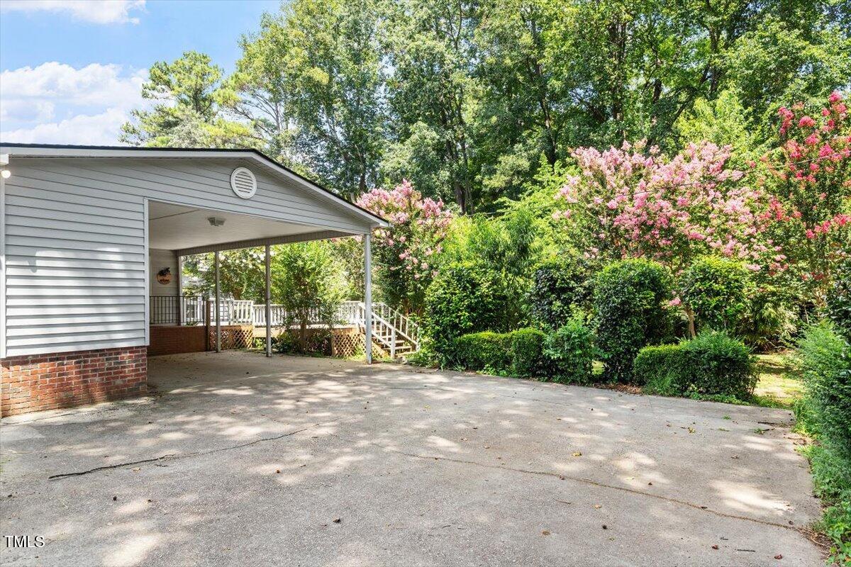 65 Pine View Road Henderson, NC 27537 - Photo 4 of 43 a view of a house with a backyard and balcony