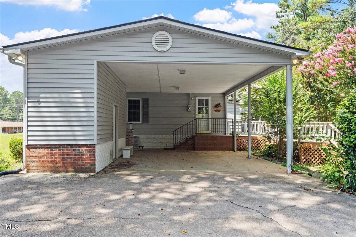 65 Pine View Road Henderson, NC 27537 - Photo 5 of 43 a view of a house with backyard and garden