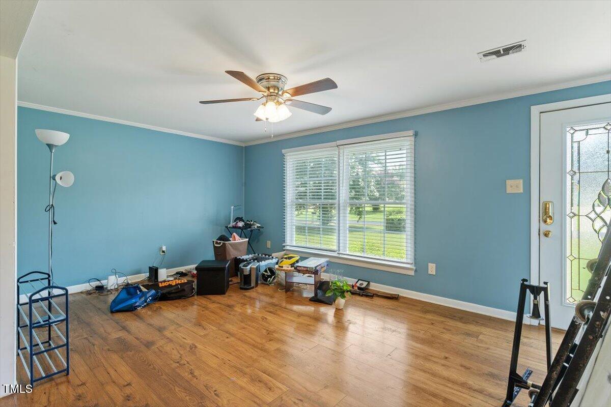 65 Pine View Road Henderson, NC 27537 - Photo 7 of 43 a living room with furniture and a large window