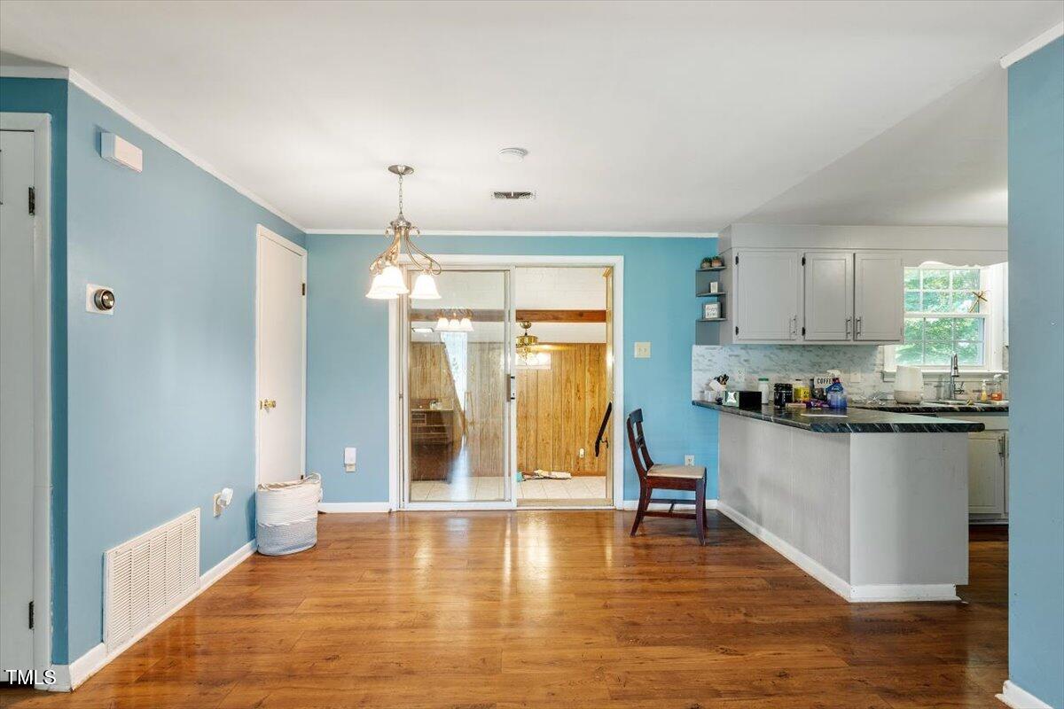 65 Pine View Road Henderson, NC 27537 - Photo 9 of 43 a kitchen with stainless steel appliances granite countertop a refrigerator and a stove top oven