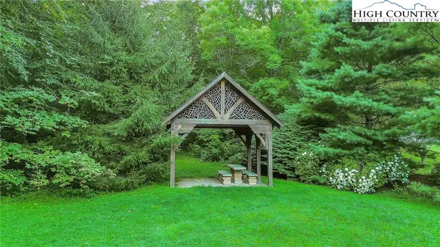 a view of front of house with a yard