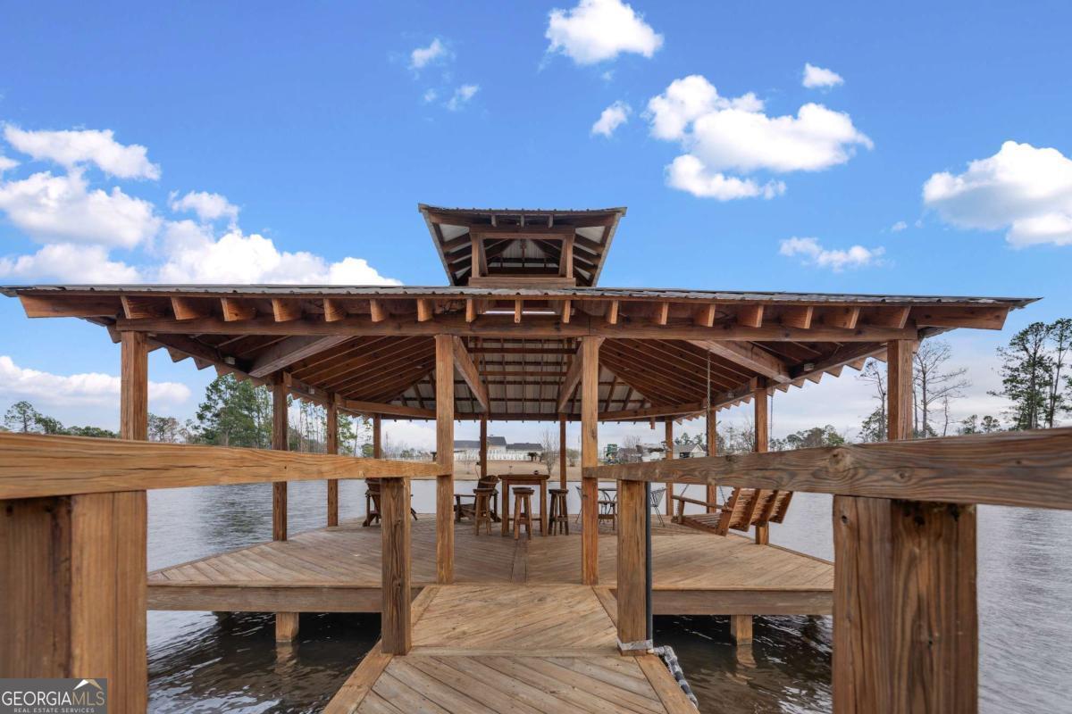 42 Claxton Road Hazlehurst, GA 31539 - Photo 33 of 73 a view of a patio with a table and chairs