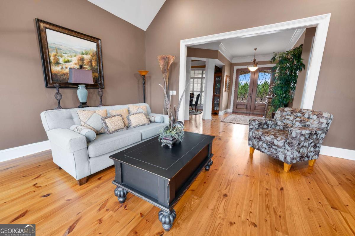 42 Claxton Road Hazlehurst, GA 31539 - Photo 38 of 73 a living room with furniture and a flat screen tv