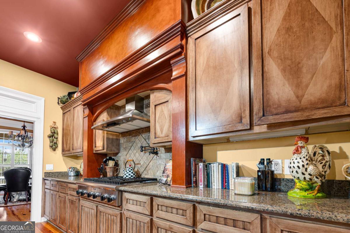 42 Claxton Road Hazlehurst, GA 31539 - Photo 41 of 73 a kitchen with stainless steel appliances granite countertop a sink and cabinets
