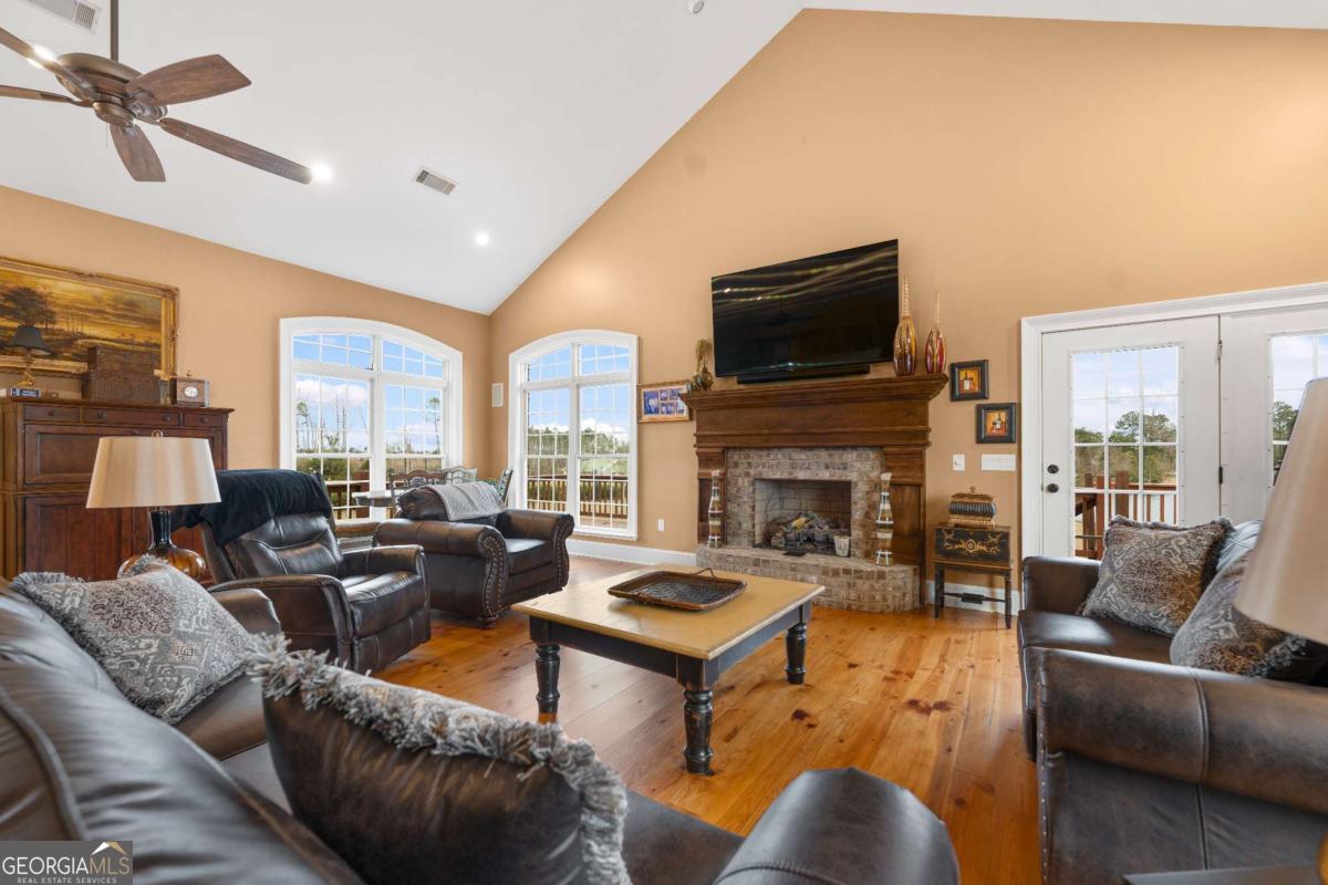 42 Claxton Road Hazlehurst, GA 31539 - Photo 46 of 73 a living room with furniture fireplace and a flat screen tv