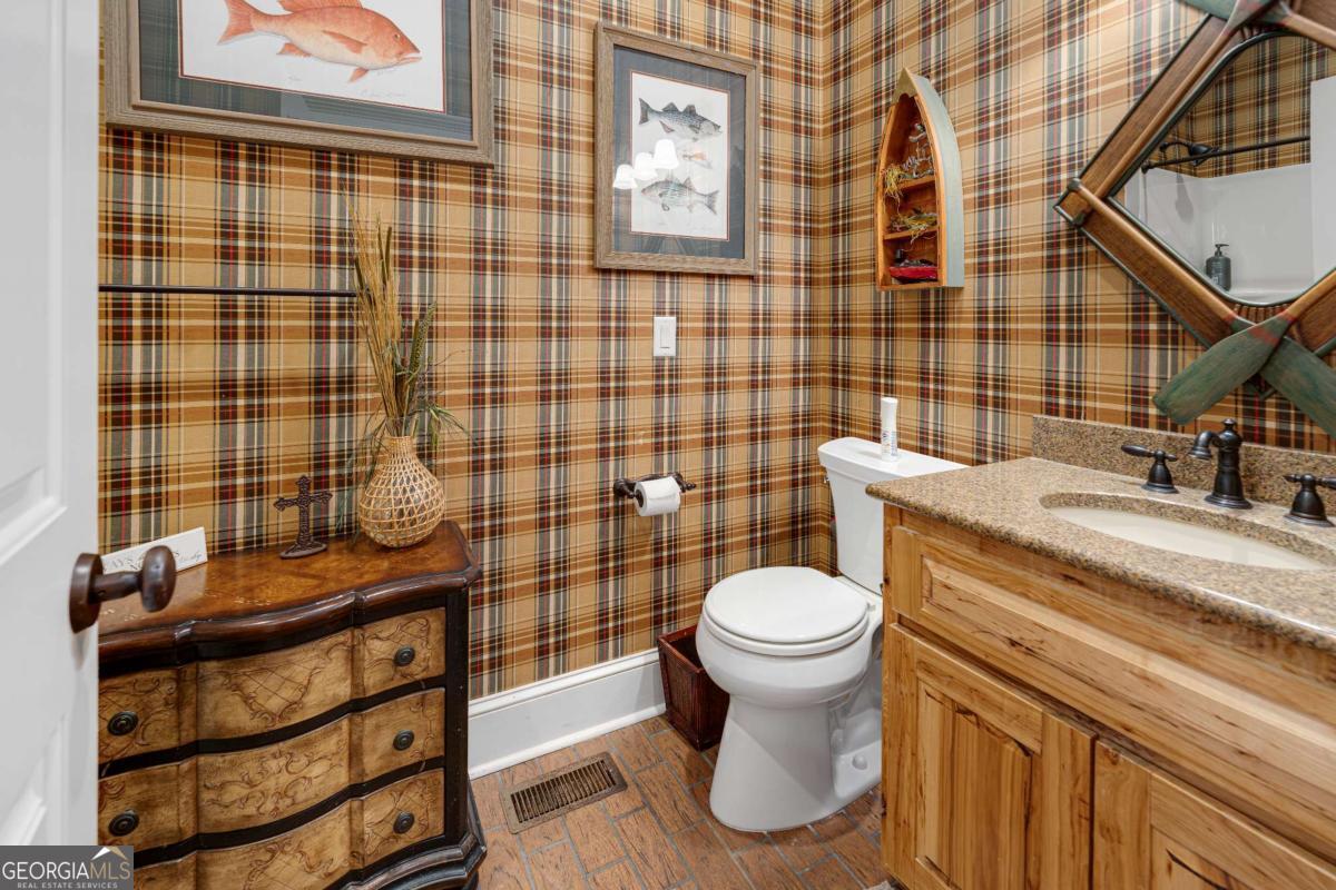 42 Claxton Road Hazlehurst, GA 31539 - Photo 51 of 73 a bathroom with a sink toilet and shower