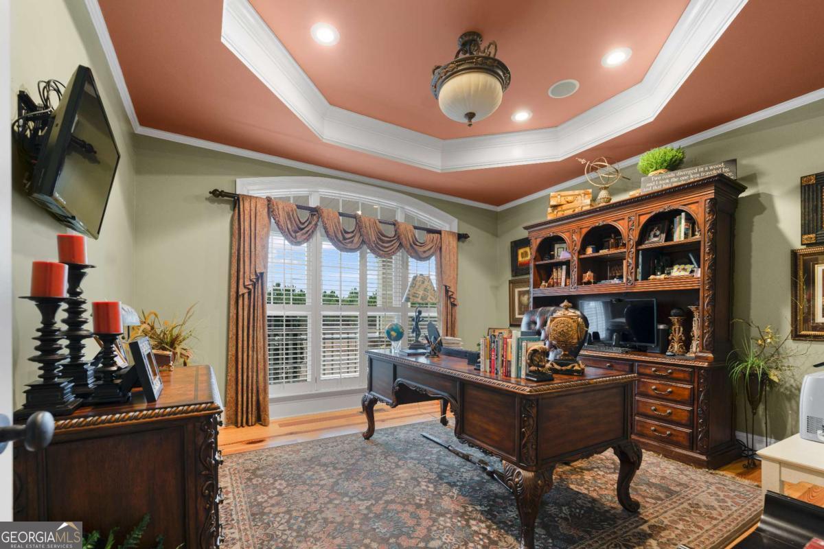 42 Claxton Road Hazlehurst, GA 31539 - Photo 55 of 73 a living room with lots of furniture and a floor to ceiling window