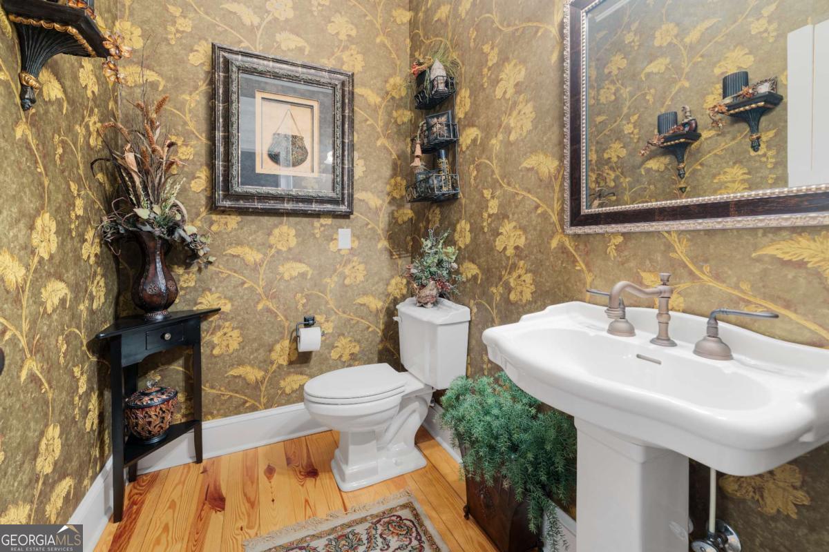 42 Claxton Road Hazlehurst, GA 31539 - Photo 56 of 73 a bathroom with a sink toilet and mirror