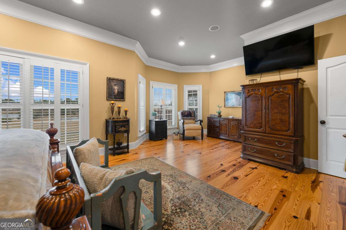 42 Claxton Road Hazlehurst, GA 31539 - Photo 58 of 73 a living room with furniture and a flat screen tv