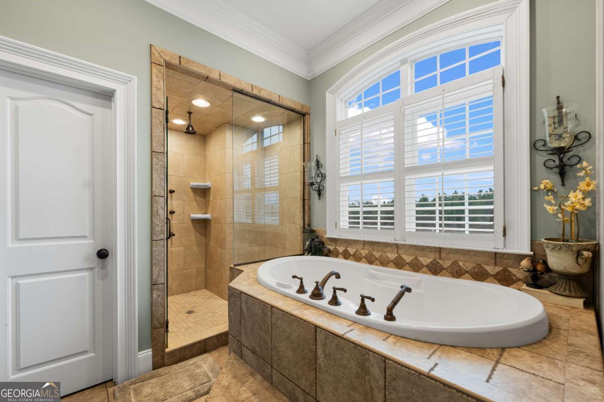 42 Claxton Road Hazlehurst, GA 31539 - Photo 59 of 73 a bathroom with a bathtub and a shower