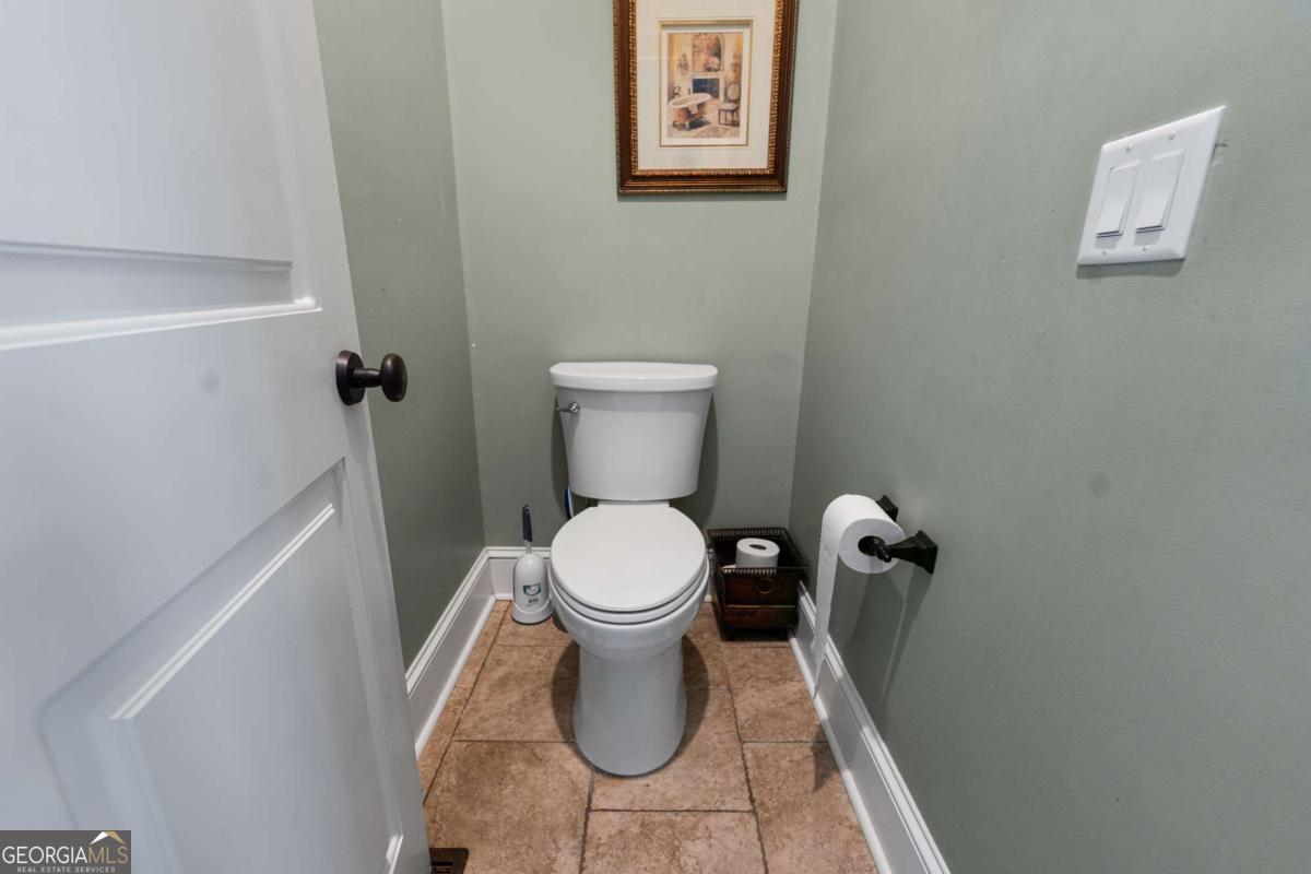 42 Claxton Road Hazlehurst, GA 31539 - Photo 61 of 73 a white toilet sitting next to a white wall