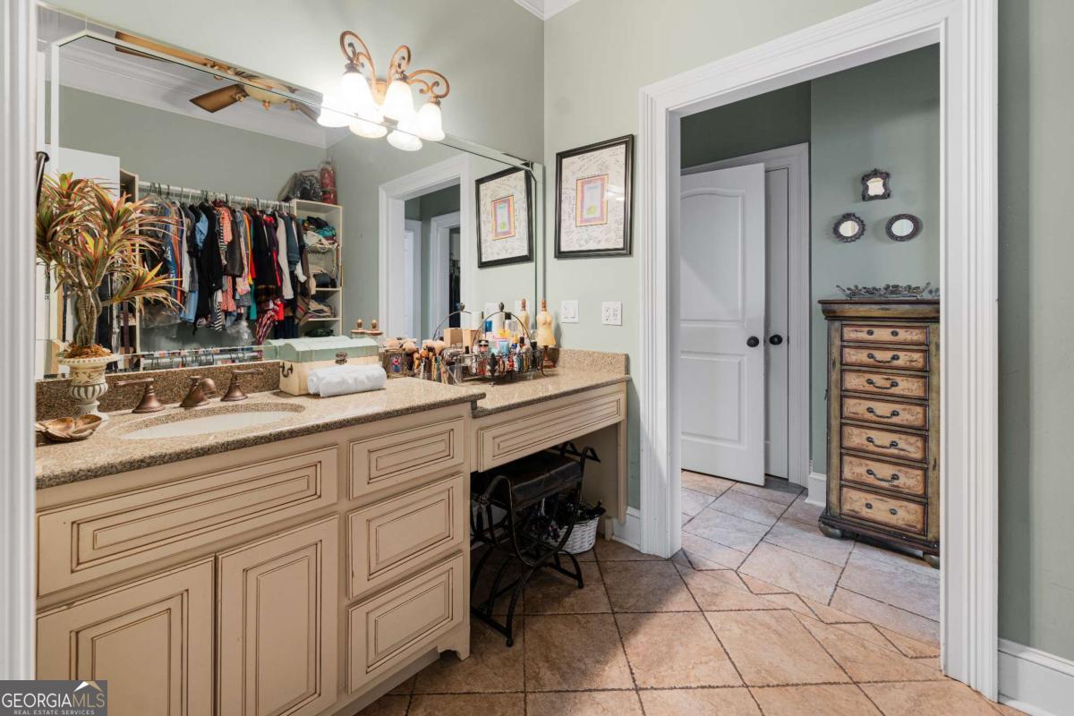 42 Claxton Road Hazlehurst, GA 31539 - Photo 62 of 73 a bathroom with a sink vanity and a mirror