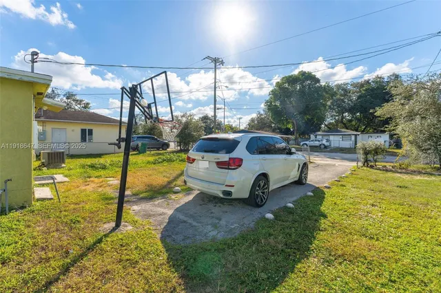 a house view with swimming pool and garden view
