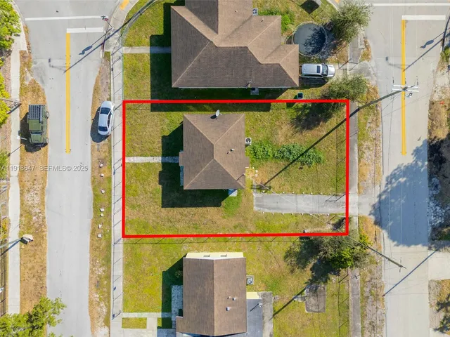 a view of a house with a street