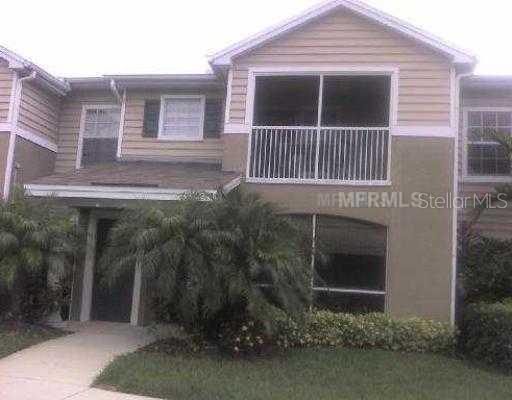8827 Manor Loop, Unit 107 Lakewood Ranch, FL 34202 - Photo 1 of 1 a view of a house with a yard
