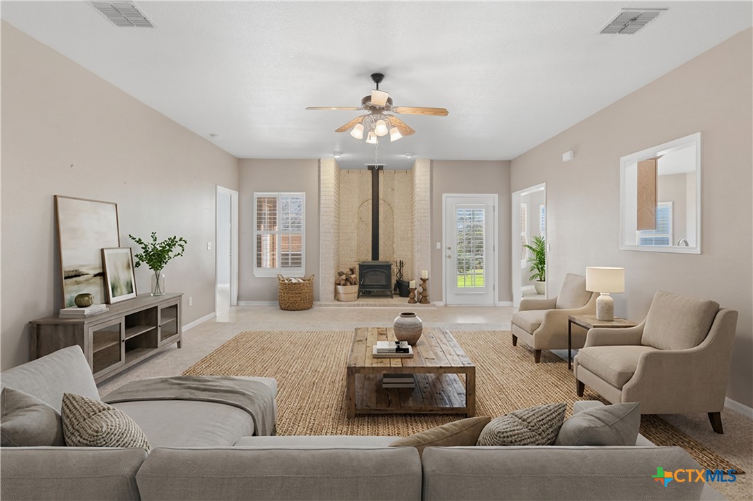 155 Guadalupe Ranch Lane Seguin, TX 78155 - Photo 16 of 48 a living room with furniture and a chandelier