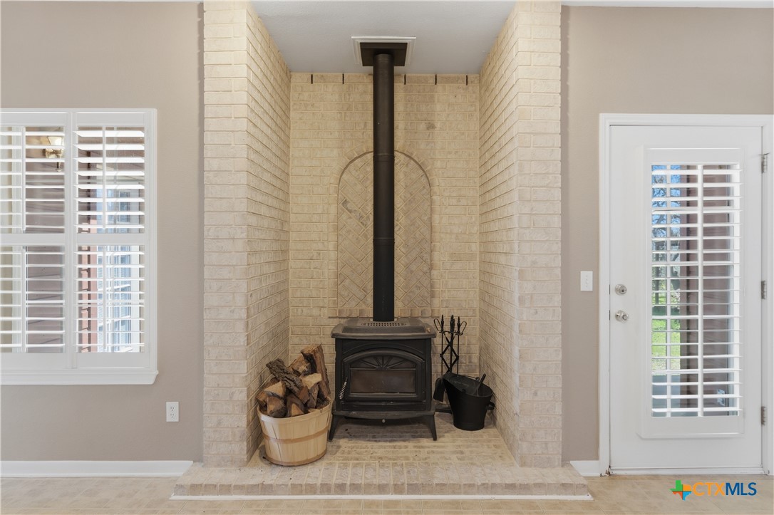155 Guadalupe Ranch Lane Seguin, TX 78155 - Photo 17 of 48 a view of a balcony with chair and potted plants