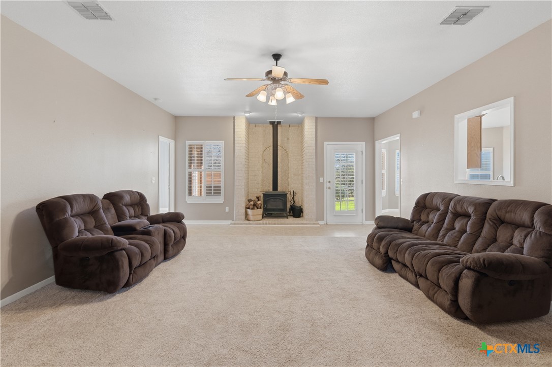 155 Guadalupe Ranch Lane Seguin, TX 78155 - Photo 18 of 48 a living room with furniture and a chandelier