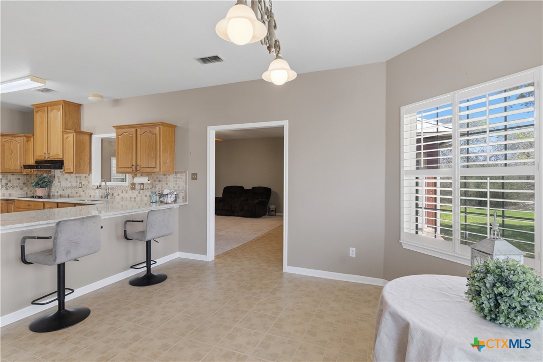 155 Guadalupe Ranch Lane Seguin, TX 78155 - Photo 19 of 48 a view of kitchen with furniture and window