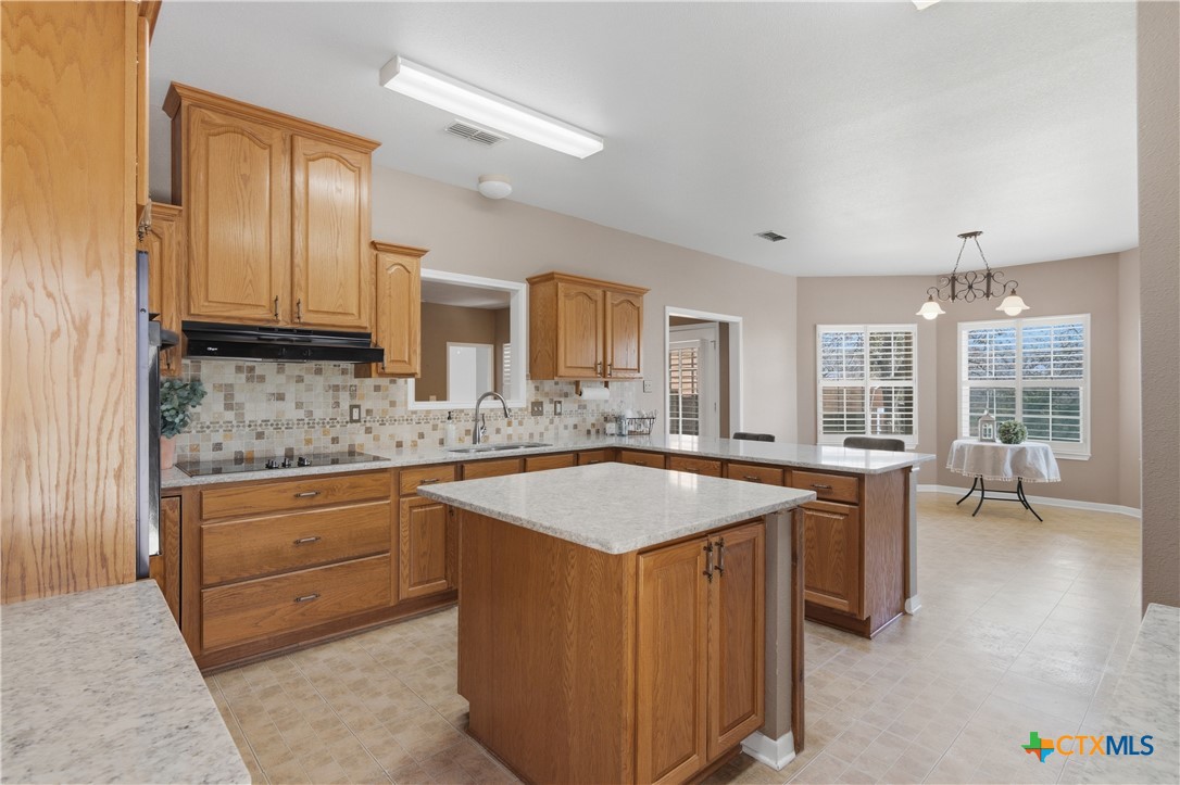 155 Guadalupe Ranch Lane Seguin, TX 78155 - Photo 27 of 48 a view of a kitchen island a sink and living room
