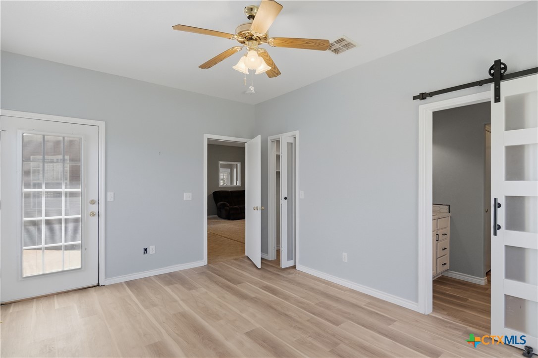 155 Guadalupe Ranch Lane Seguin, TX 78155 - Photo 29 of 48 wooden floor in an empty room with a window